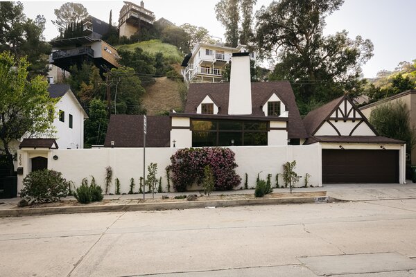 Set on a quiet street in L.A.'s Los Feliz neighborhood, the historic home features a tall privacy wall that hides a spacious front courtyard.