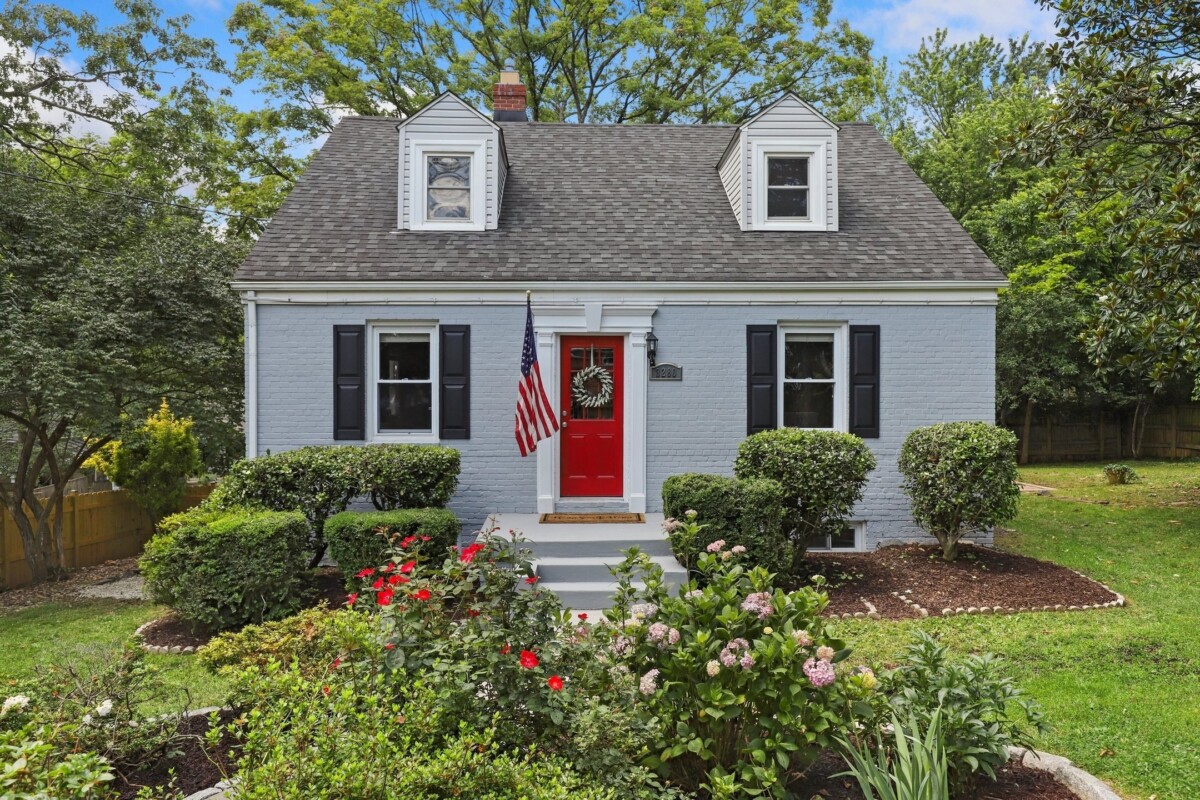 cape cod home with red front door