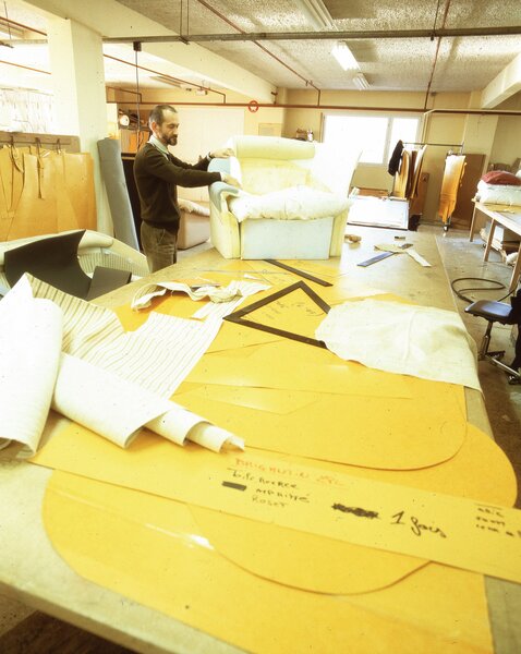 Michel Ducaroy designed a range of furniture for young people along with chairs, settees, and other pieces for public facilities before teaming up with Jean Roset. Ducaroy is seen here in Ligne Roset's design office in 1973 with a prototype.