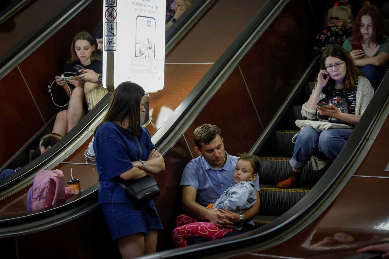 People shelter inside a subway station during an air raid alert, amid Russia's attack on Ukraine, in Kyiv, Ukraine, May 29, 2023.