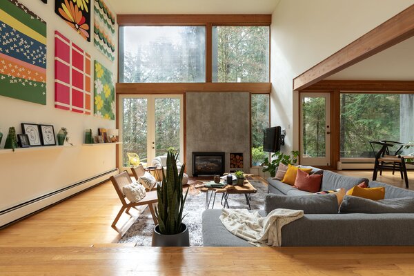 Expansive windows and glass doors span across the main living areas, enhancing the home's strong indoor-outdoor connection while also drawing in ample natural light.