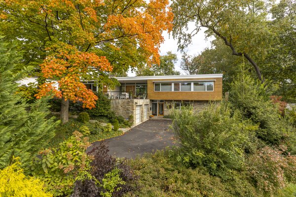 Though conveniently located to Washington, D.C., the multi-story residence offers a quiet city escape, tucked away on a lush, tree-filled lot.