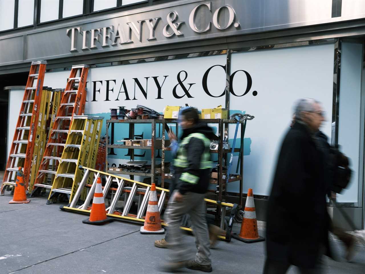 Ladders and construction supplies lean against window of Tiffany store