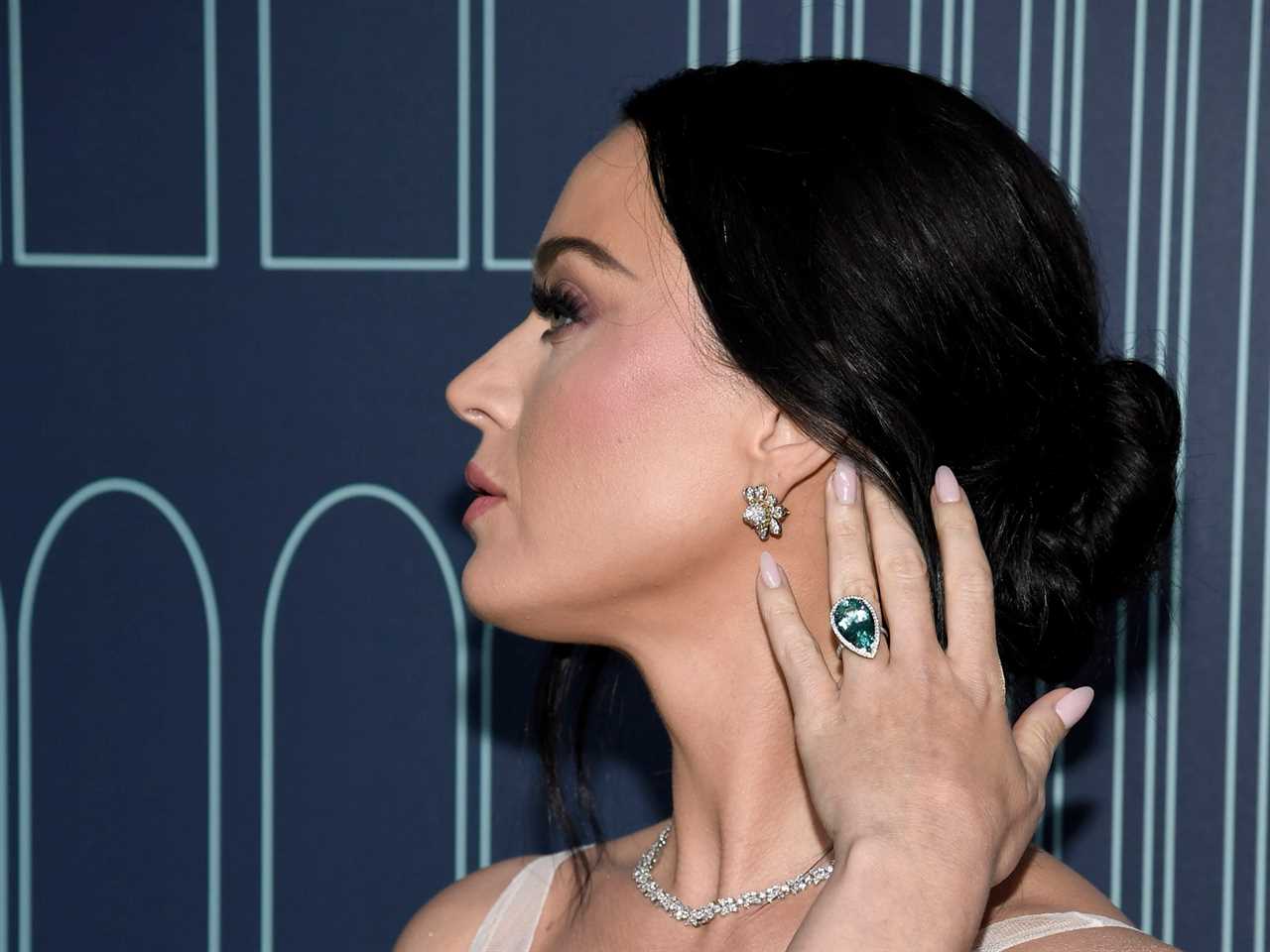 Katy Perry turns head to side to show earrings and ring at Tiffany event