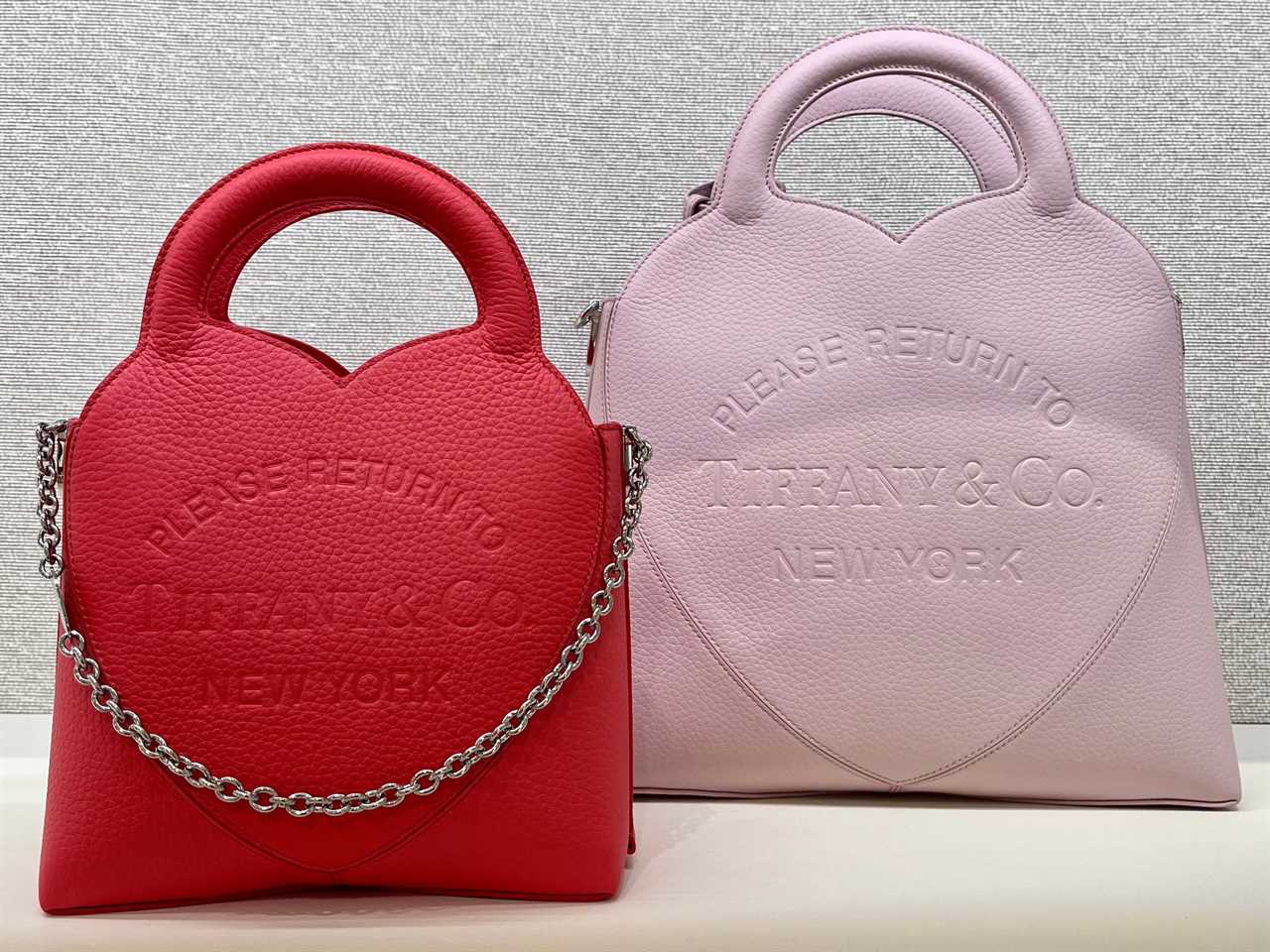 Red and pink heart-shaped Tiffany bags displayed on shelf