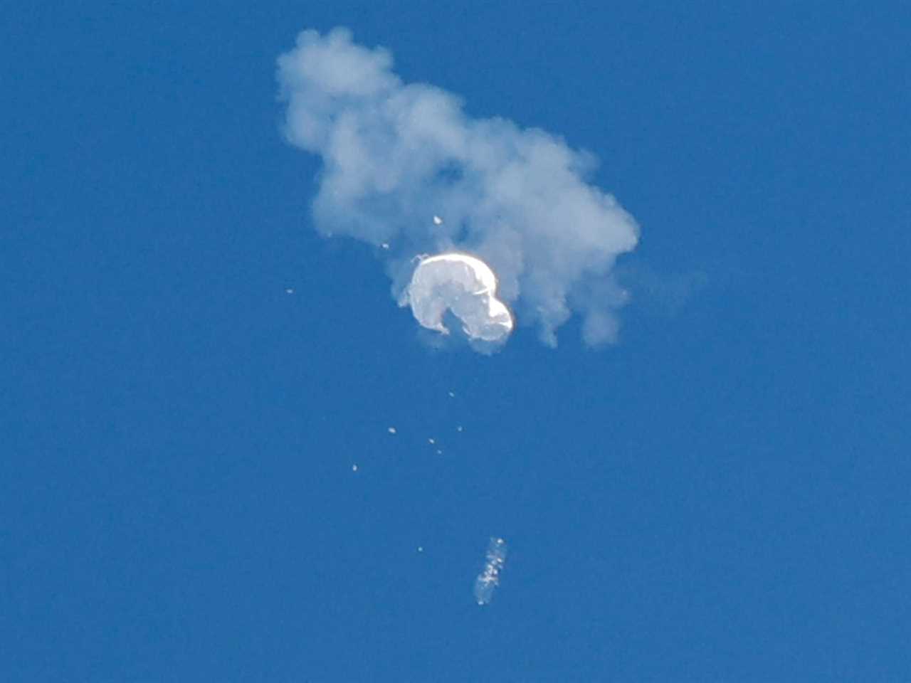 The suspected Chinese spy balloon drifts to the ocean after being shot down off the coast in Surfside Beach, South Carolina, U.S. February 4, 2023.