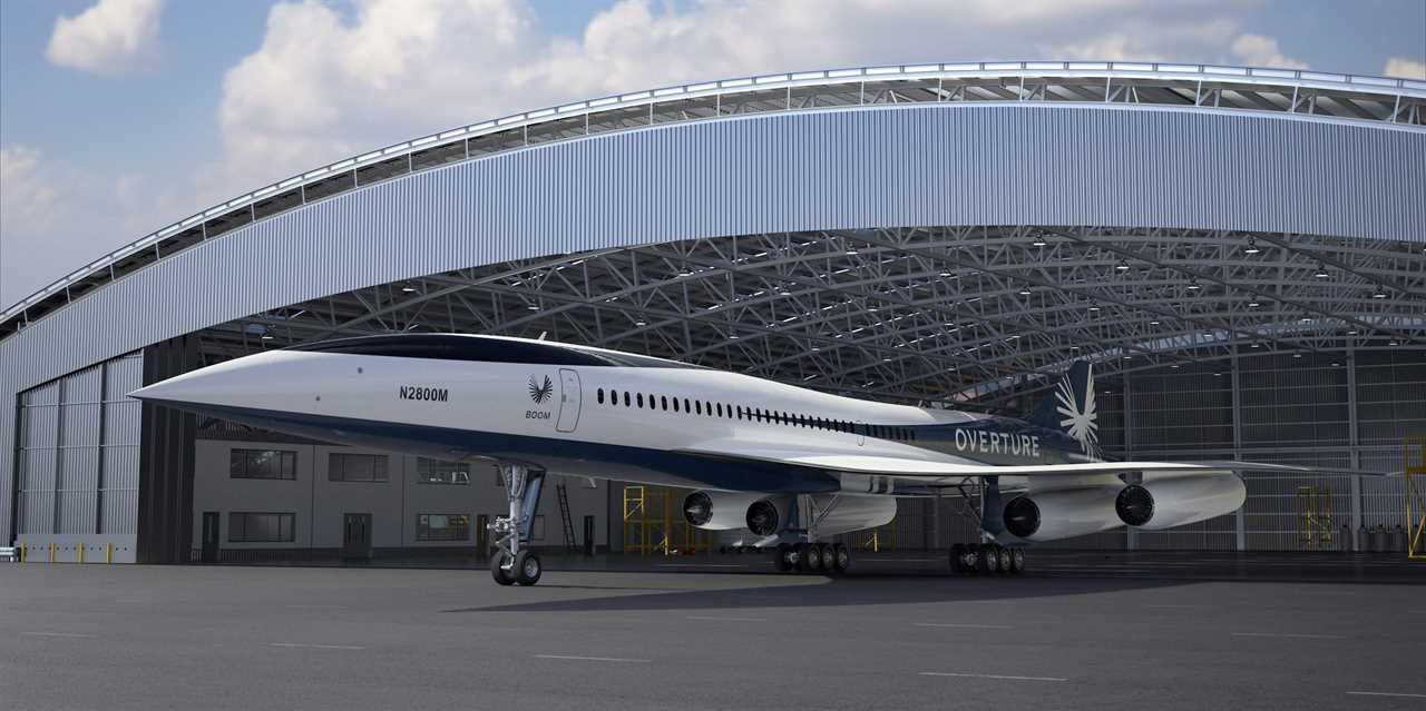 Boom Supersonic's Overture by a hangar.