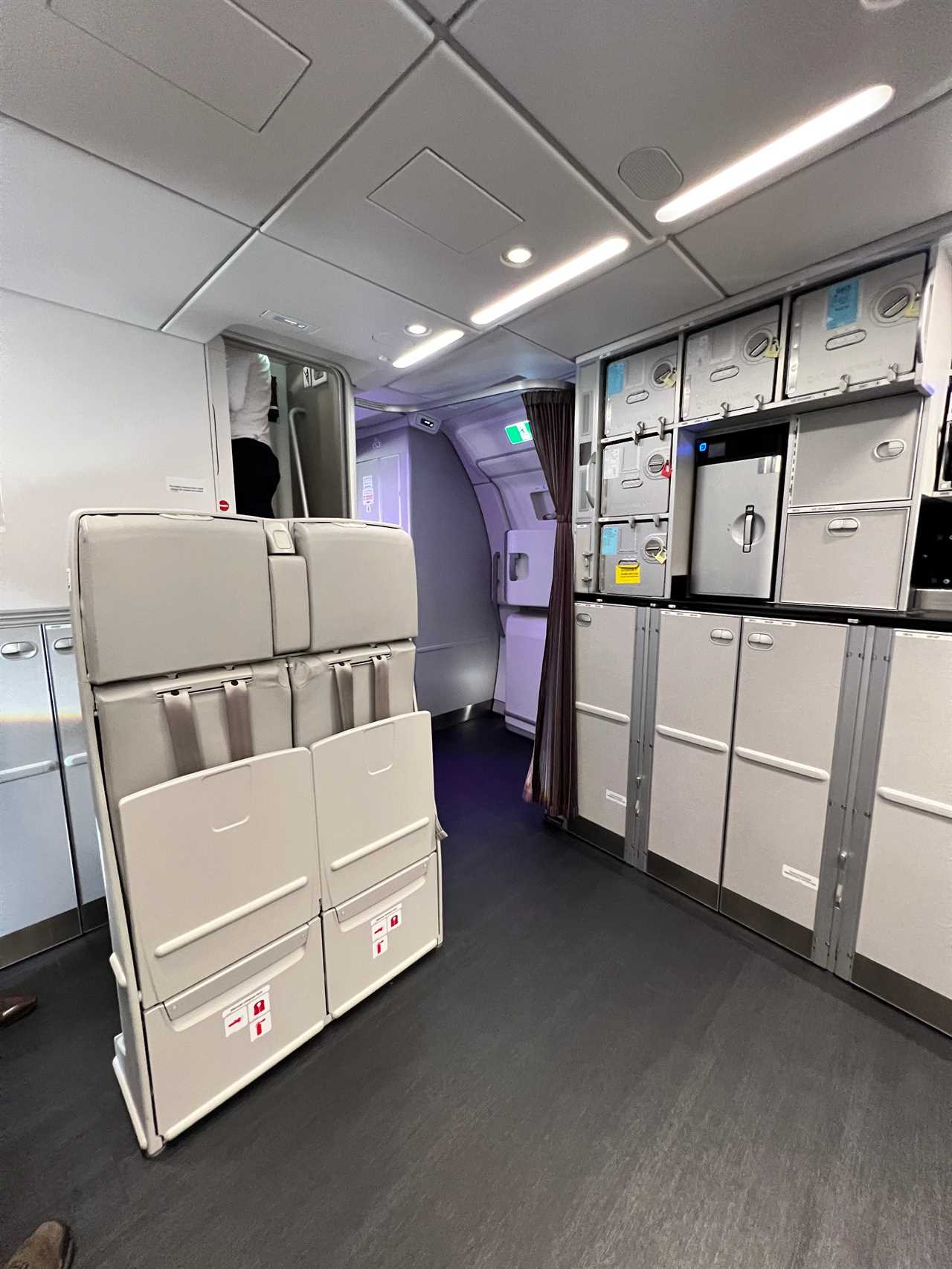 A closeup of the pull-down flight attendants' seats in the A350 rear galley