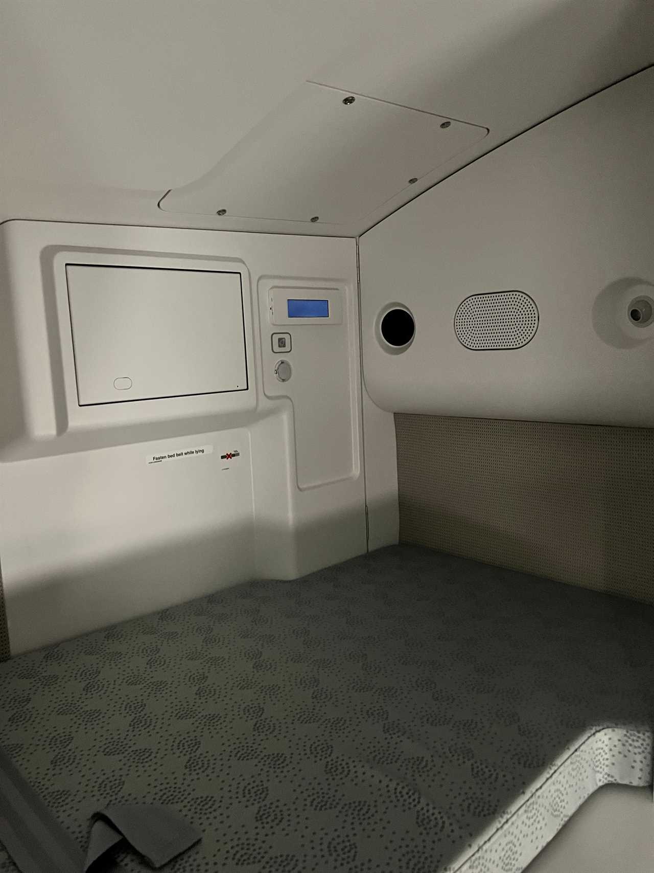 A closeup of the bunk area in the A350's crew rest area, including a speaker and a light.