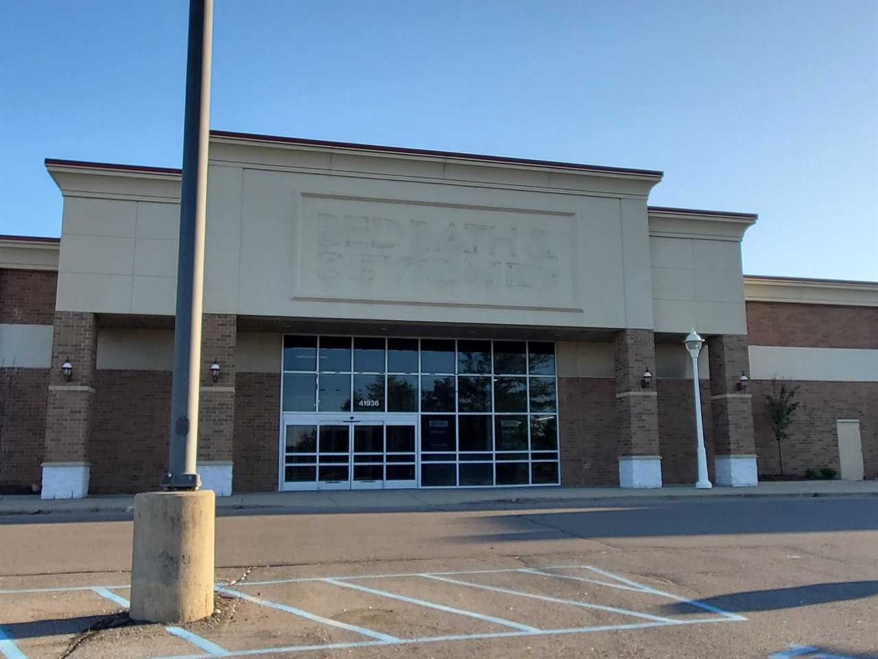 A closed Bed Bath & Beyond in Canton, Michigan, with remnants of the old store sign still visible.