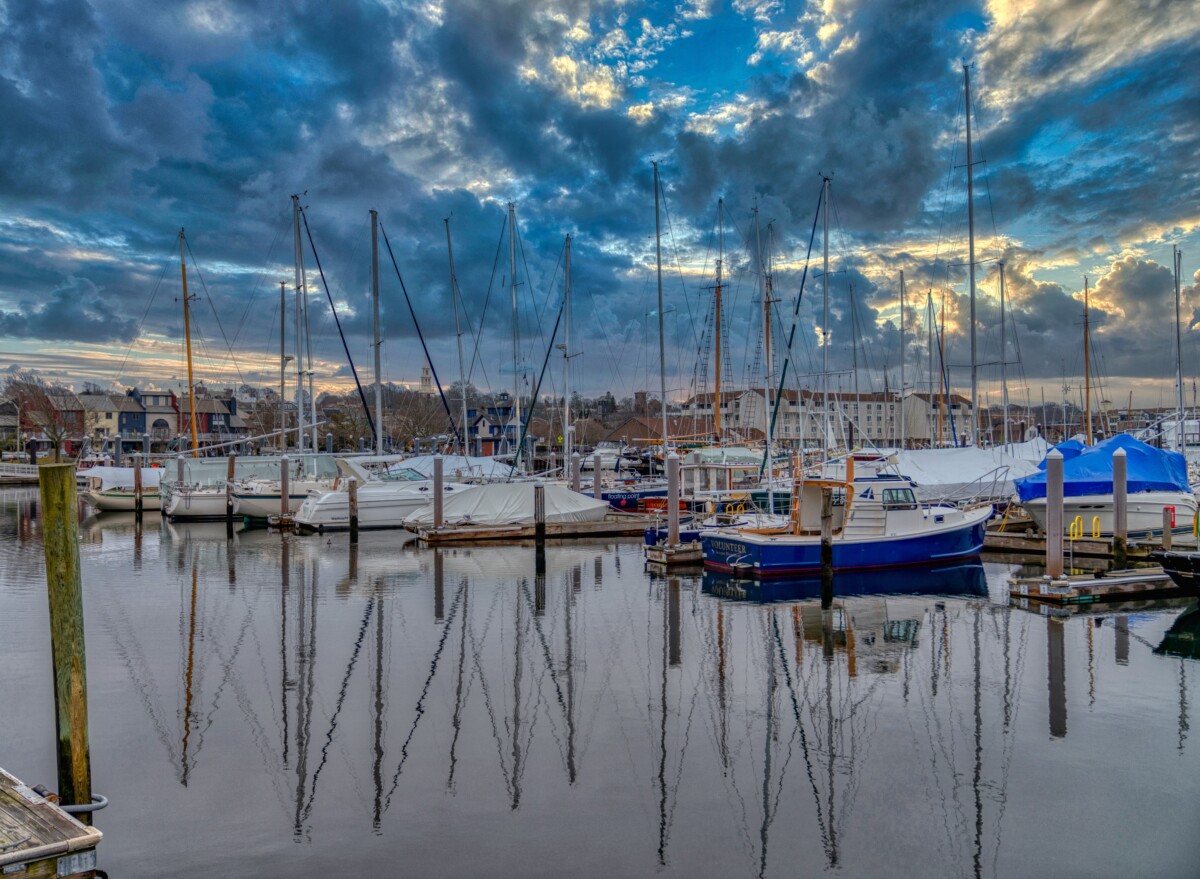 newport rhode island harbor with clouds and boats