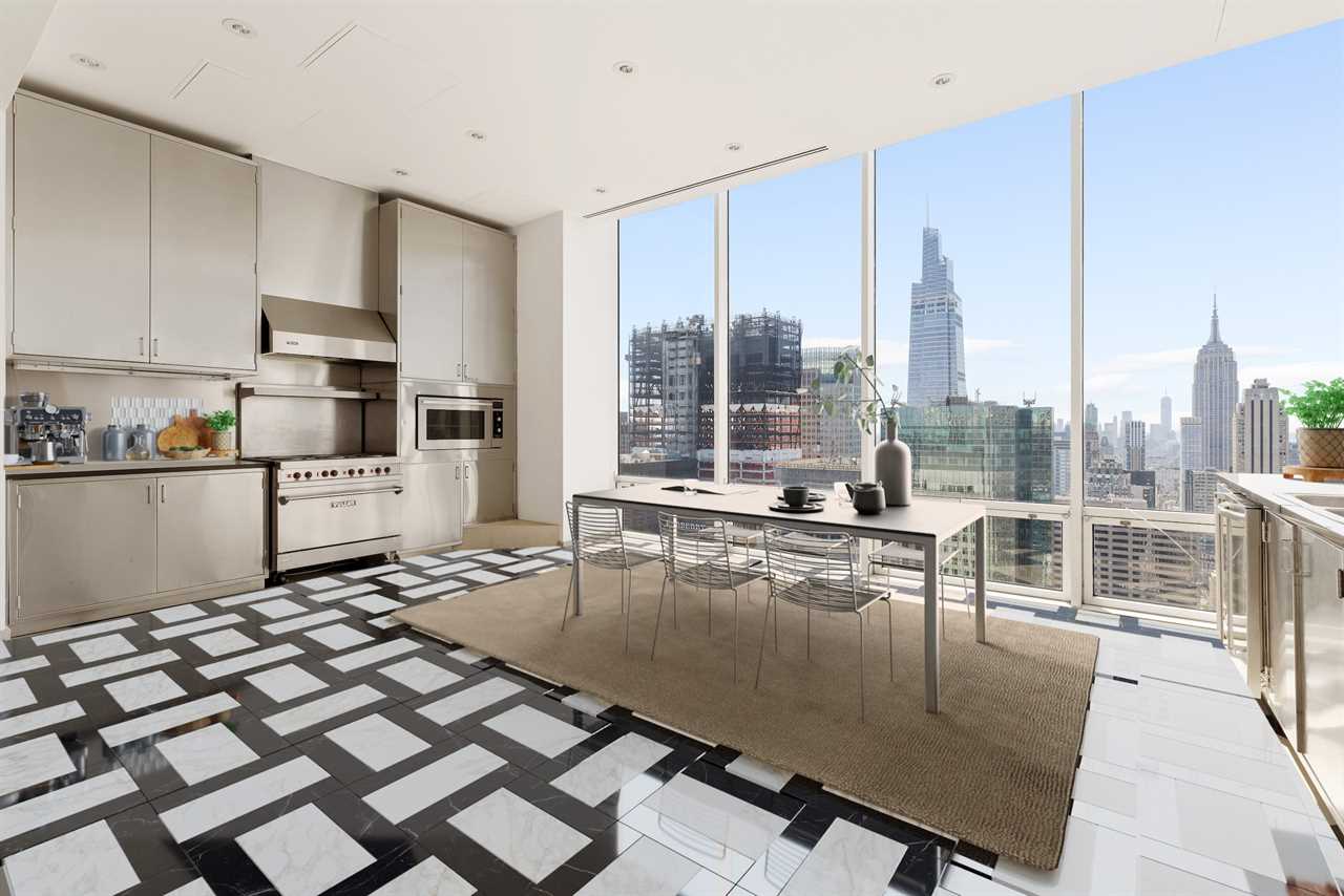 A kitchen with floor-to-ceiling windows in a penthouse.