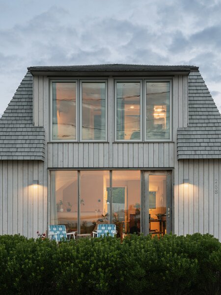 The home has a mansard roof with shakes and real hardwood tongue and groove siding. 