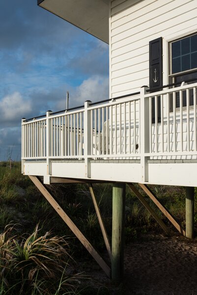 The home was set on piles when it was built to give the protected dunes below room to sprawl.