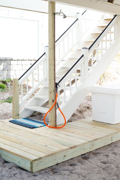 An outdoor shower and foot washing station offer a place to rinse off after a day spent at the beach.