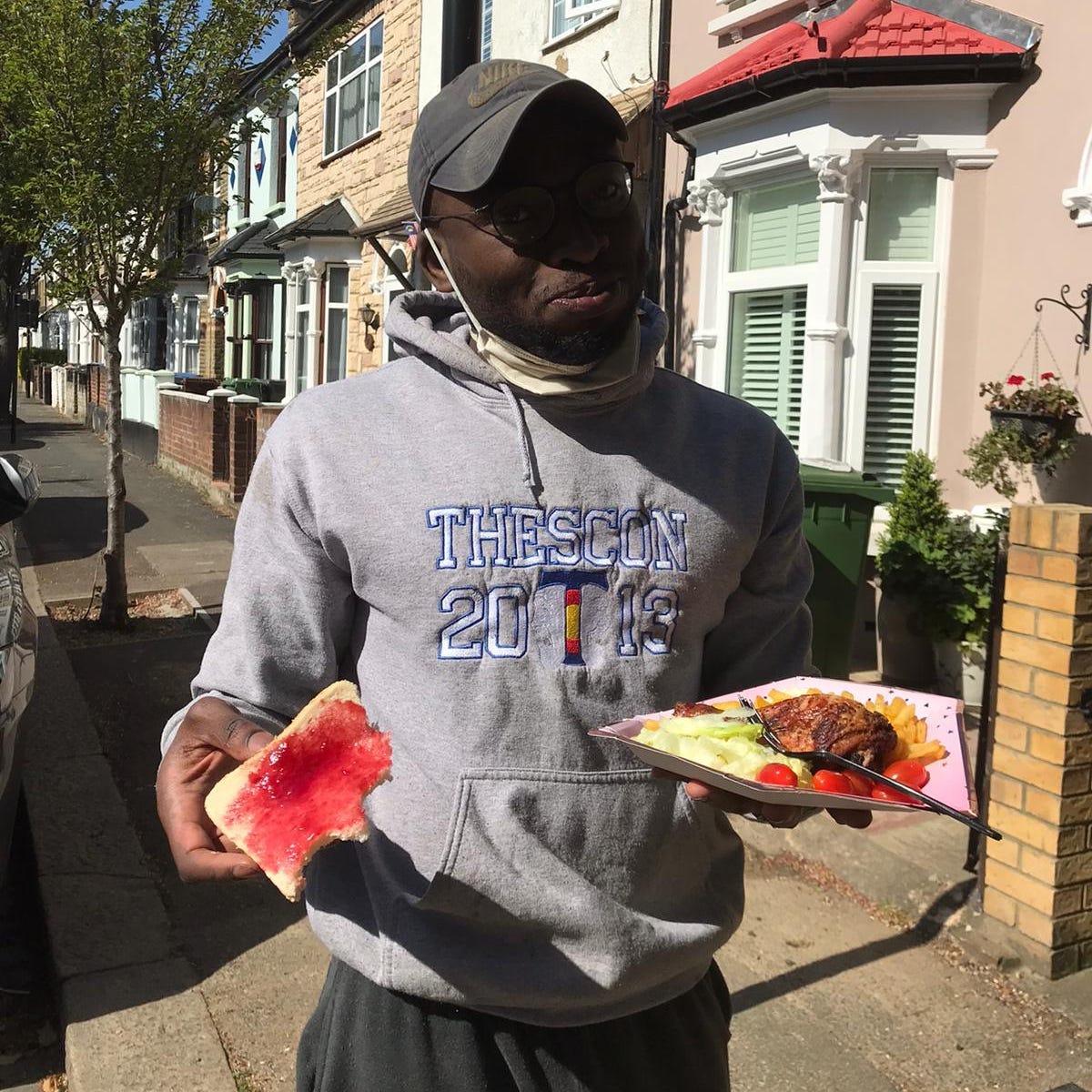 Olamide Soyemi stood outside his new home eating bread and jam.