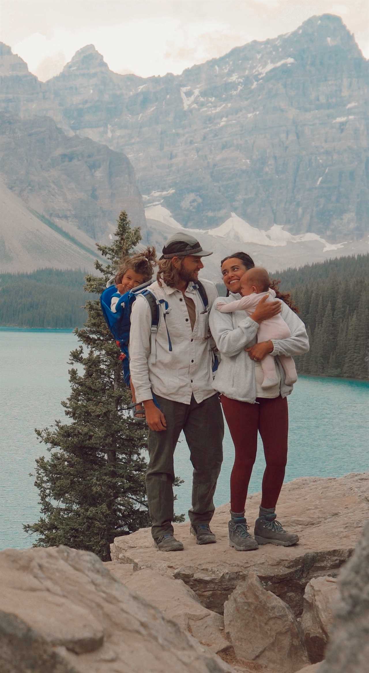 A family hiking with their two young children.