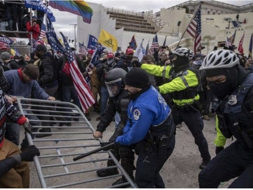 Thomas Patrick Hamner in a "tug-of-war" with police at the Capitol riot.