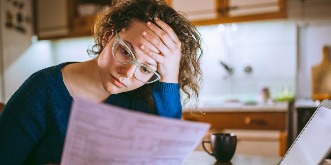 Woman reading bills