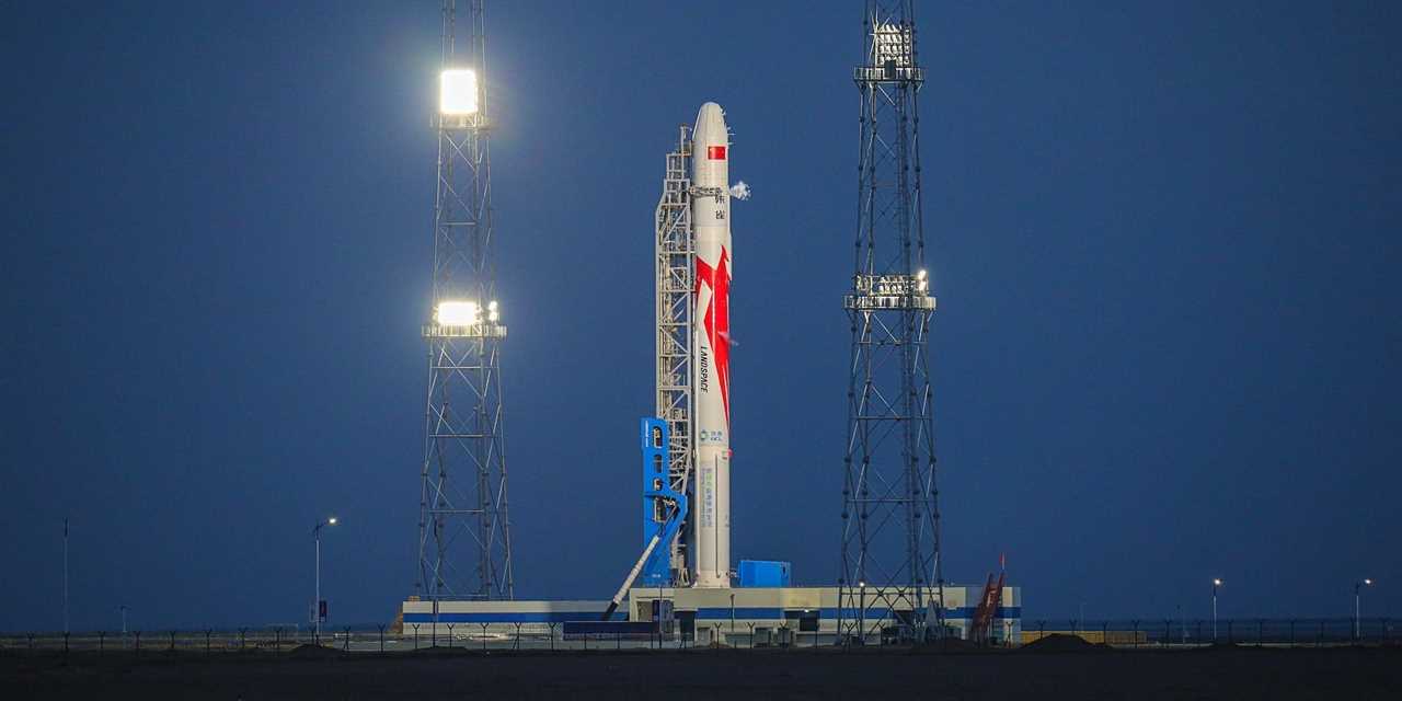 Chinese LandSpace's Zhuque-2 rocket is seen on its launchpad at night