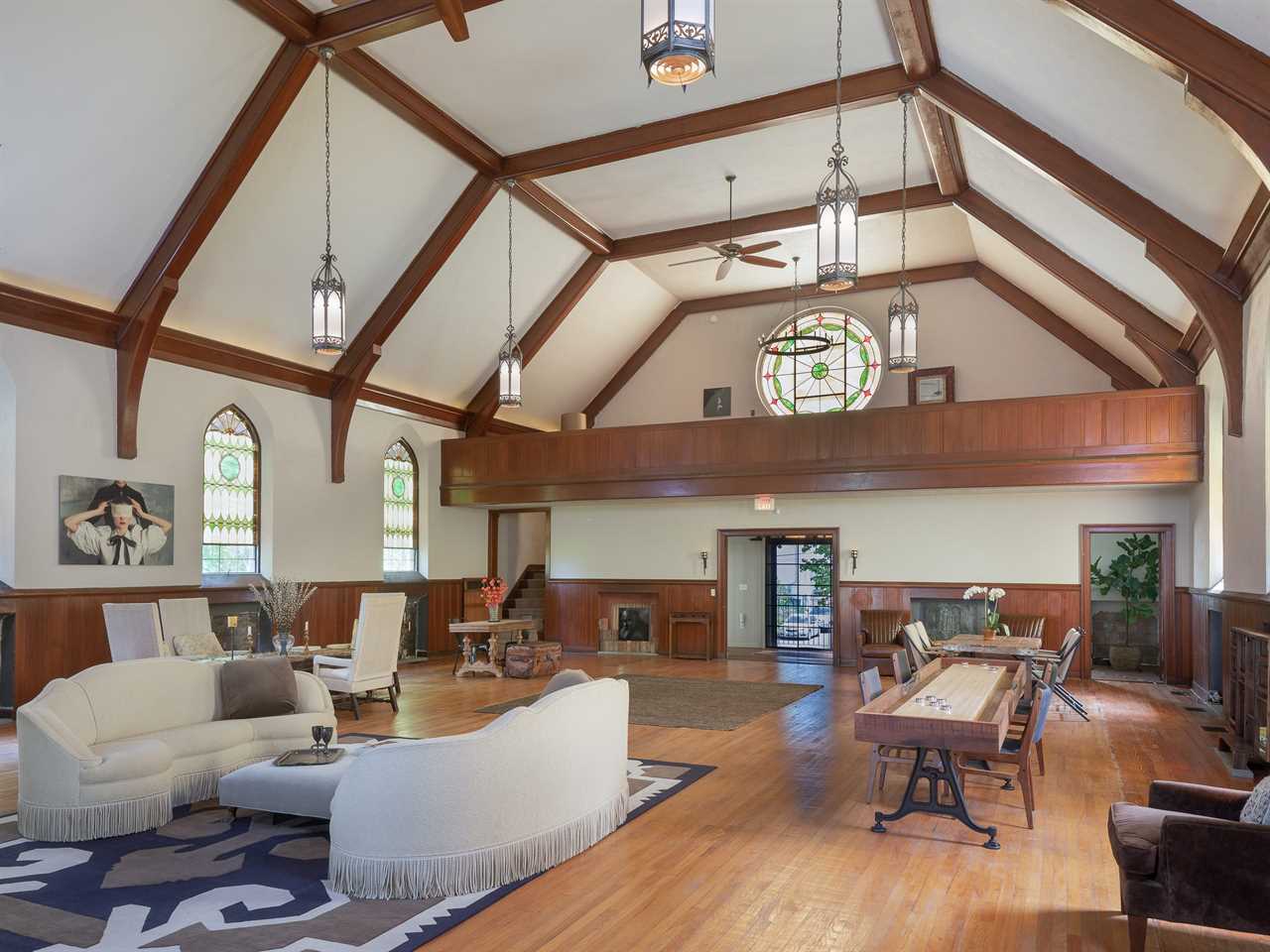 Wooden beams criss cross the high vaulted ceiling.