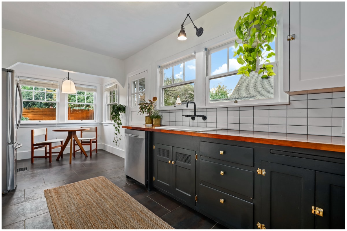 Kitchen with dark painted cabinetry