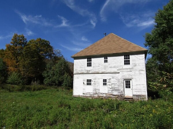 Before: The home was in extreme disrepair, but its form appealed to the family. 