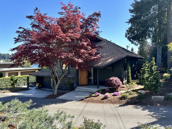 The clients opted to keep the existing shell of the home, using paint, landscape, and a new front door to freshen up the exterior.