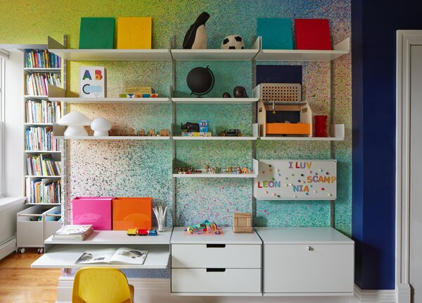 The wallpaper is the Heavens Dondi Colorscape from Flat Vernacular. A Vitsoe modular shelving unit will age with the child’s storage needs.