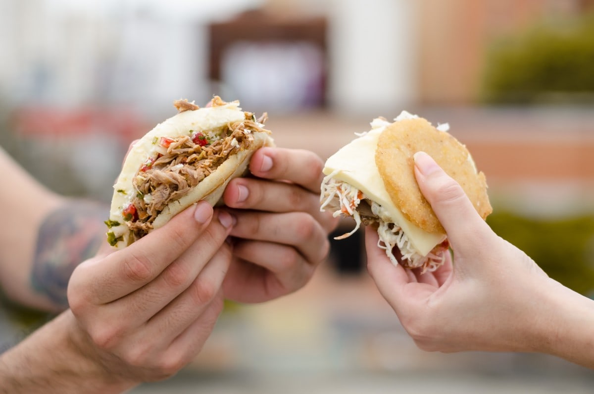 people holding arepas at leesburg virginia restaurants