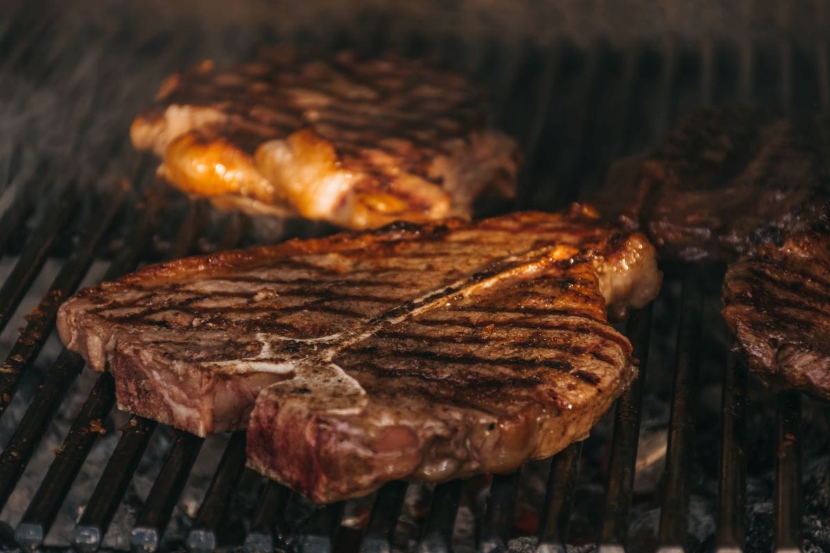 steak on a flaming grill