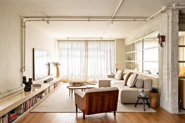 Creamy Tile Polishes Up a Brazil Apartment’s Rough Concrete Edges