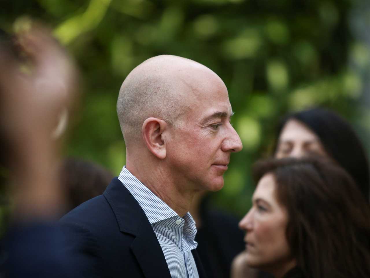 Jeff Bezos looking down