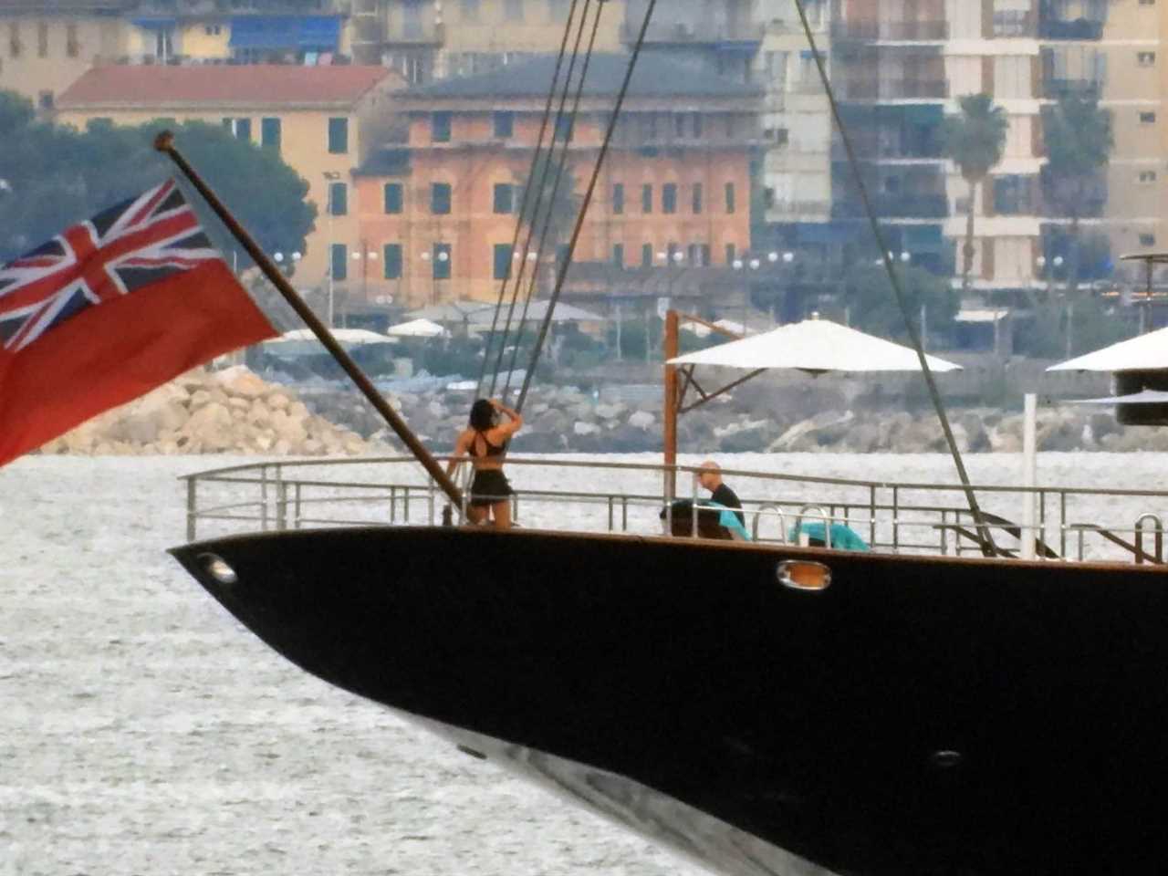 Distance shot of Jeff Bezos and Lauren Sanchez on a yacht.