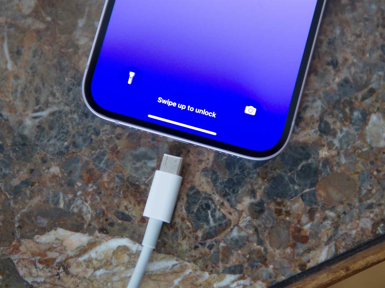 USB-C charging cable and iPhone.