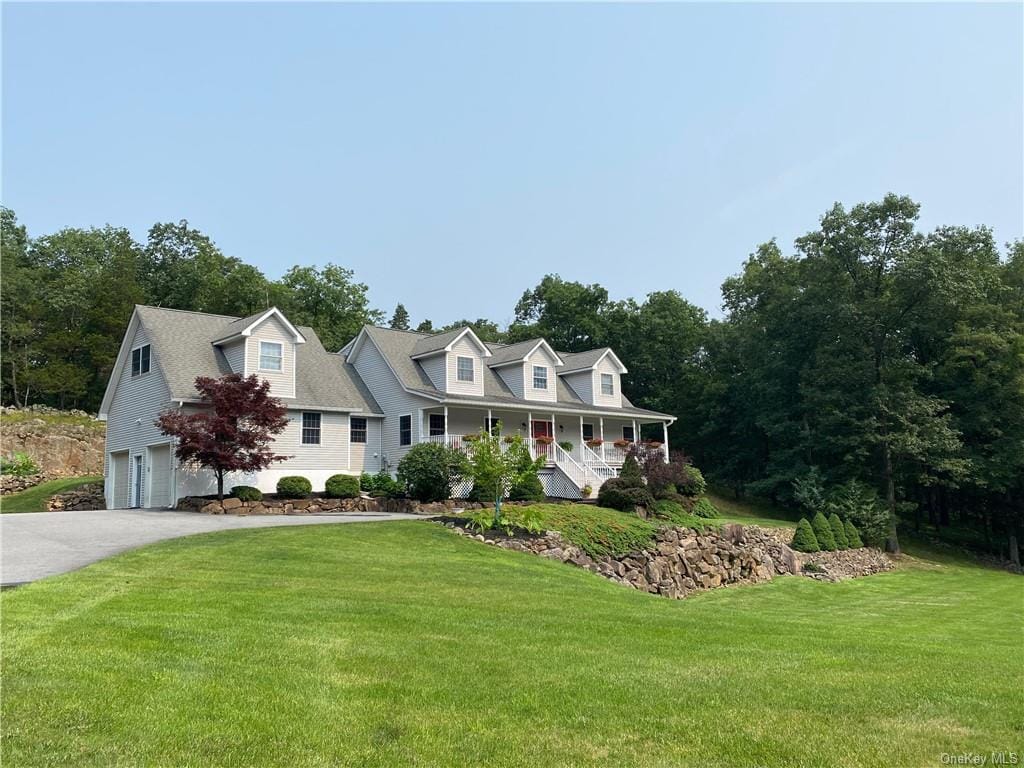 white home surrounded by trees in ct