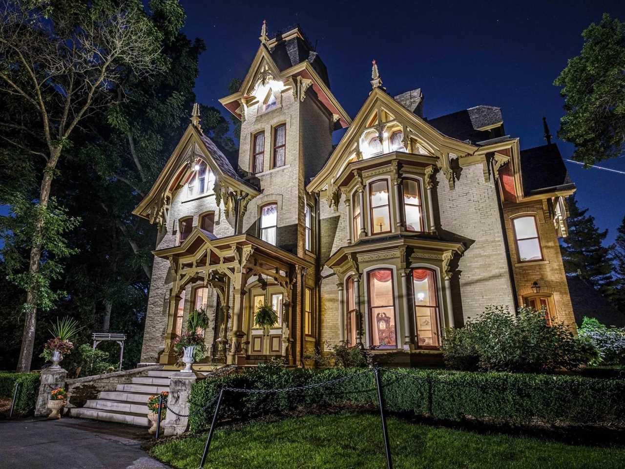 A Victorian mansion at night.