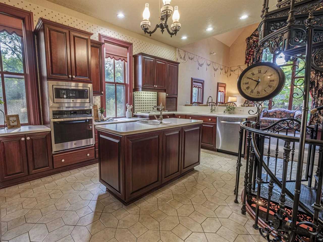 A kitchen with wooden cabinets.