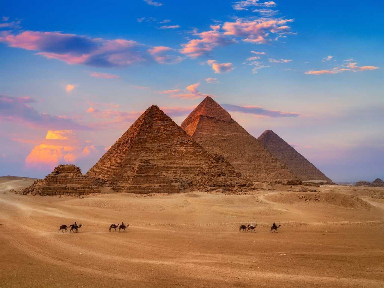 Pyramids of Giza in Egypt at sunset.