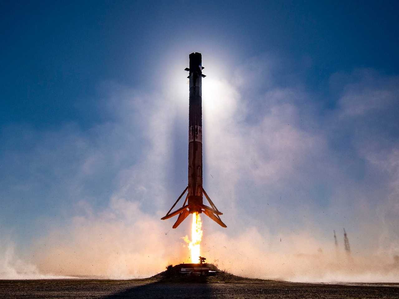 A booster, not the Super Heavy, is shown landing on earth.