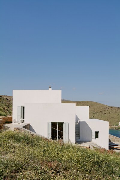 Although simple, the house has a striking impact on the site, inviting onlookers in through small penetrations in the blocky form.