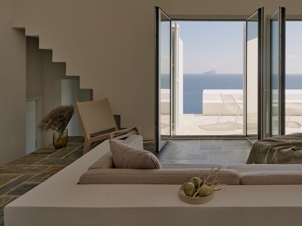 "The ever changing color of the sea and sky can be experienced from everywhere in the house. From the inside, the view of the small uninhabited Piperi Island is perfectly framed from all three beds, the bathtub, the dining table, and the sofa."