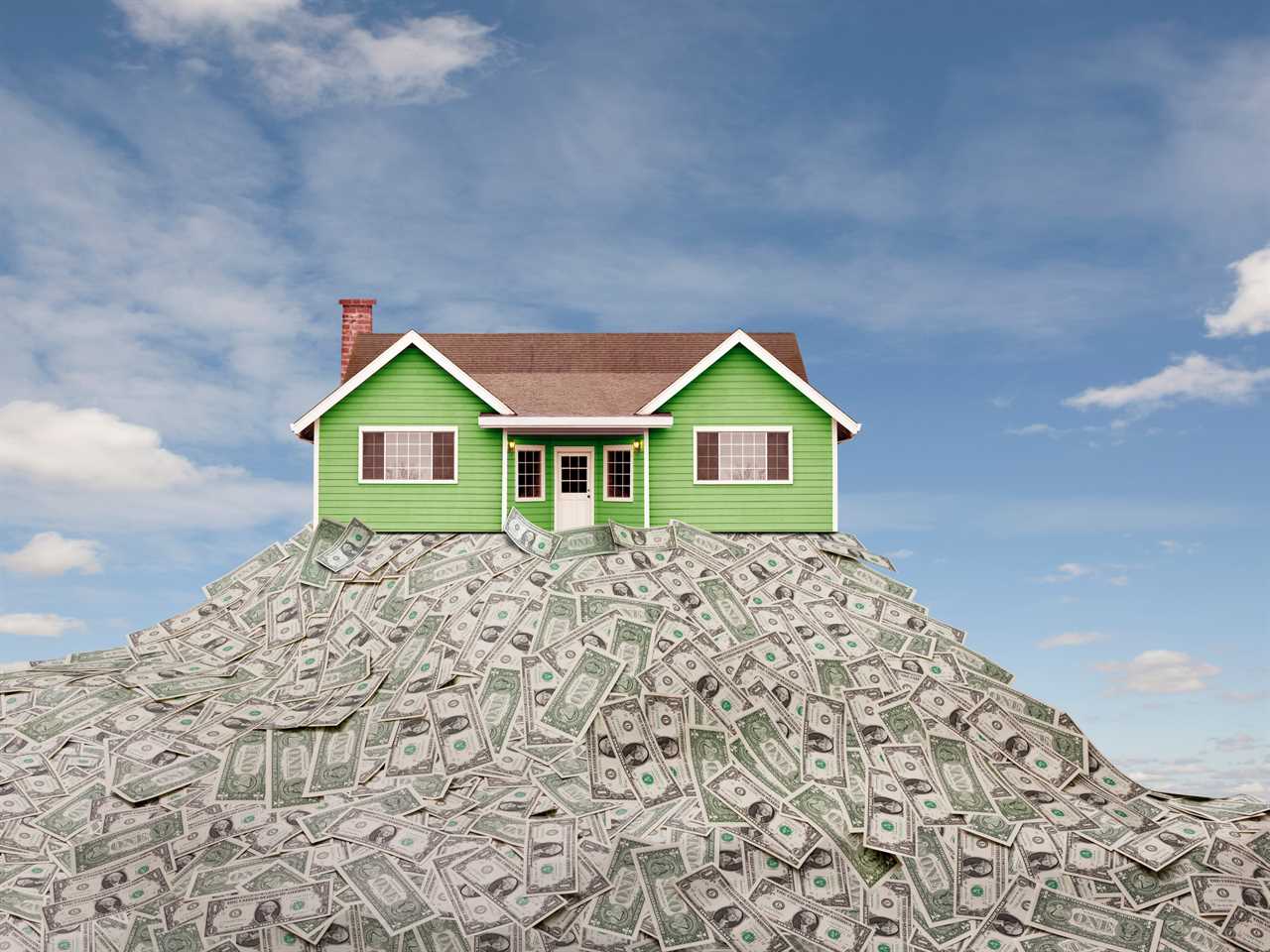 house sitting on a pile of money