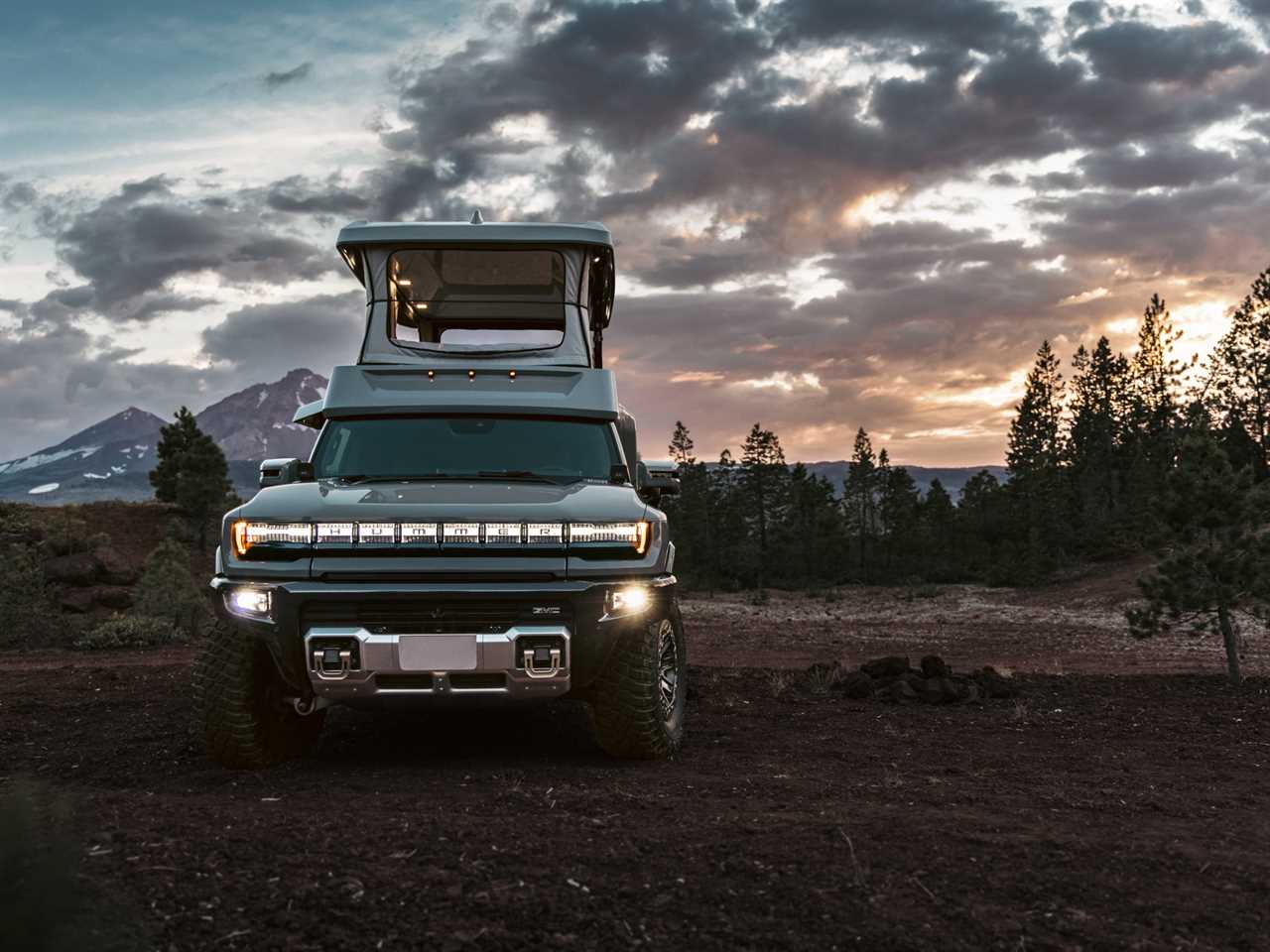 The GMC Hummer EV with EarthCruiser's upfit while parked in uneven terrain