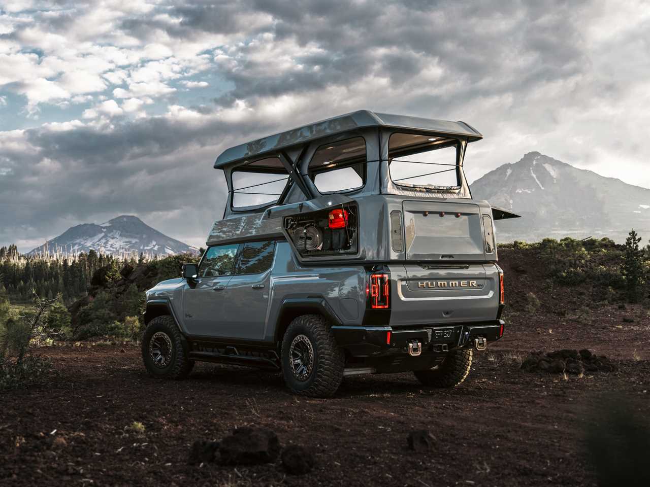 The side of a GMC Hummer EV with EarthCruiser's upfit