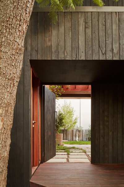 Dark Timber Cladding Hides a Soaring Extension at the Rear of This Australian Cottage