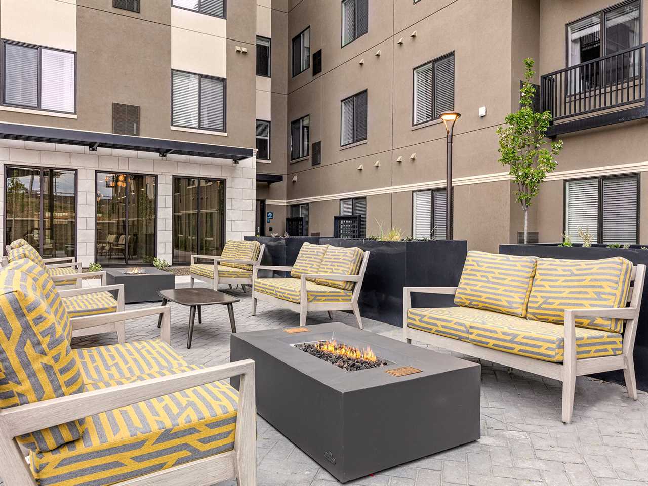 The outdoor lounge with fire pits of the WaterWalk hotel in Meridian, Idaho