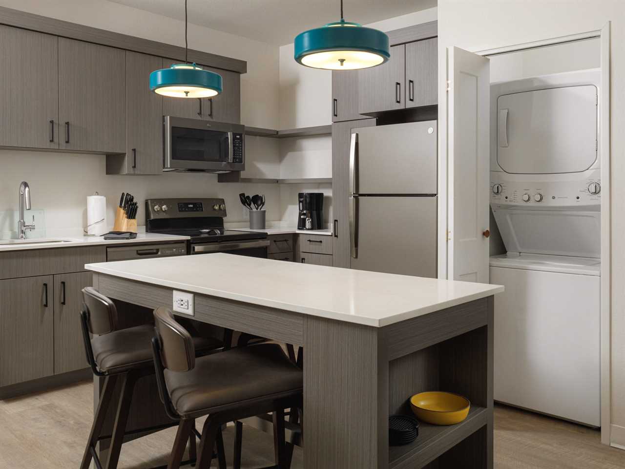 The kitchen of a two-bedroom WaterWalk hotel room.