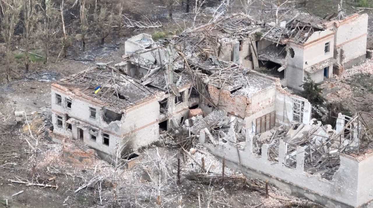 Ukrainian forces raise the national flag in the settlement of Robotyne, Zaporizhzhia region, Ukraine, in this screen grab taken from a social media video.