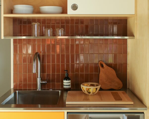 Heath Ceramics gifted the firm the ceramic backsplash tile.